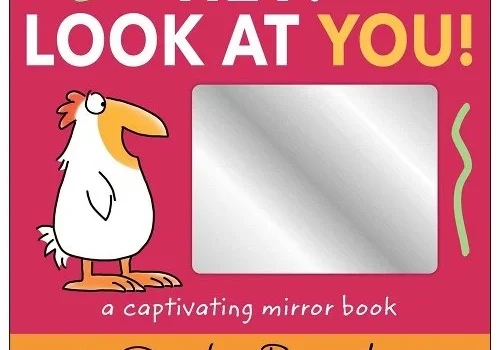 A book with a mirror on the front of it.